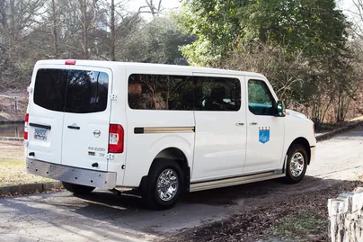 Eastern Royal Medical Transport high-roof van with the company crest on the door